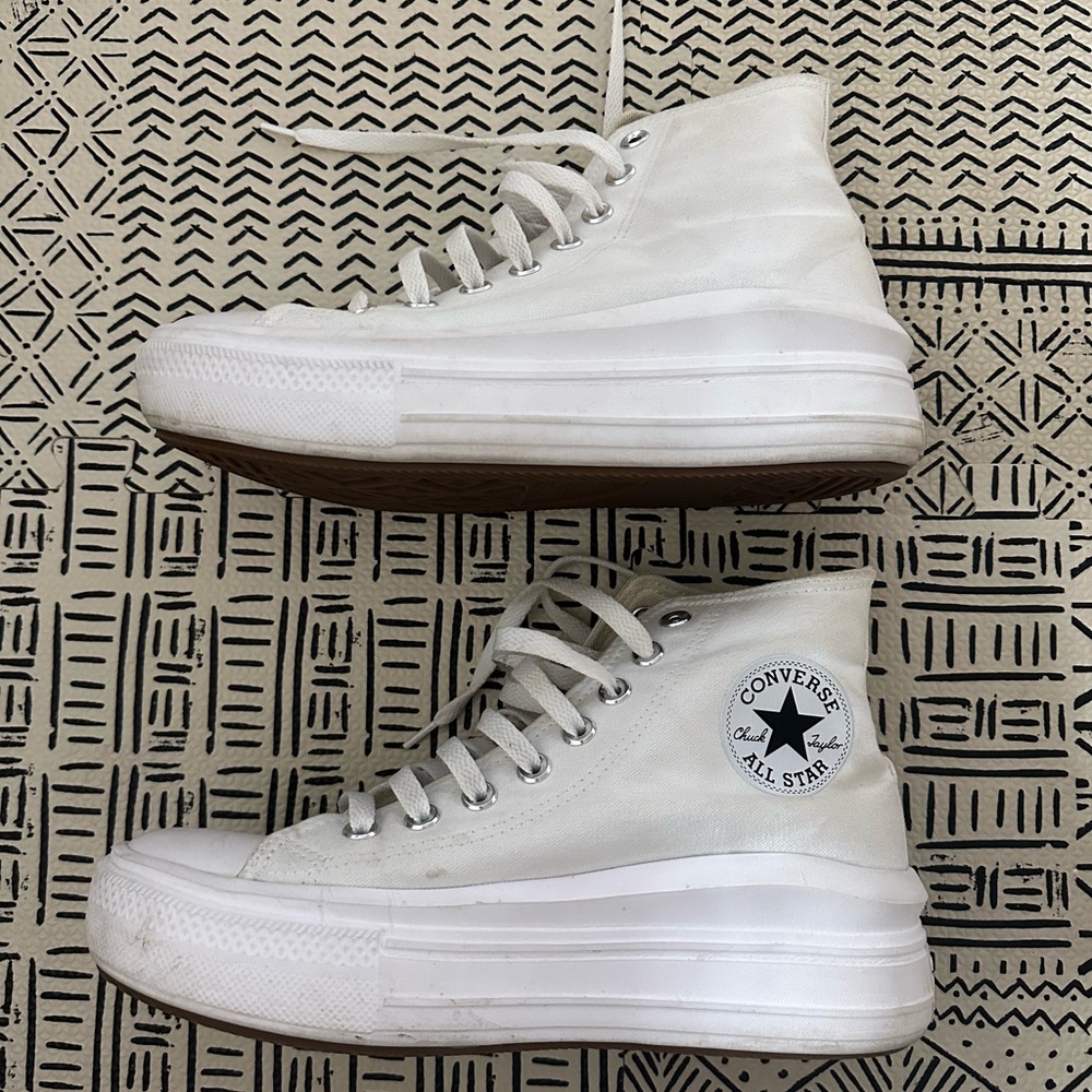 White high top converse with platform.